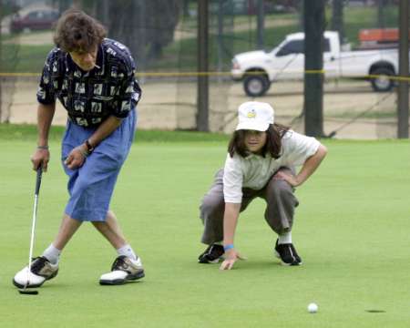 Edward playing golf in 1999 with his son Wolfie